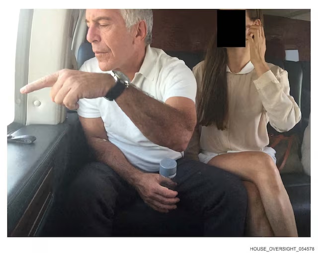 Late financier and convicted sex offender Jeffrey Epstein appears with a woman, whose identity has been obscured, in this image from the Epstein estate released by House Oversight Committee Democrats in Washington, D.C., U.S., on December 18, 2025. House Oversight Committee Democrats/Handout via REUTERS 