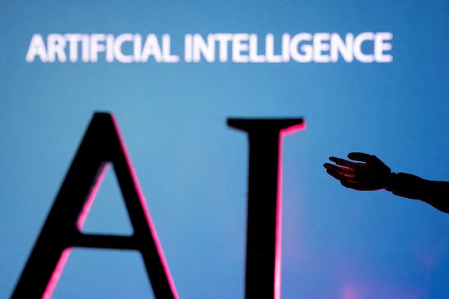 AI (Artificial Intelligence) letters and robot hand miniature in this illustration taken, June 23, 2023. REUTERS/Dado Ruvic/Illustration/File Photo