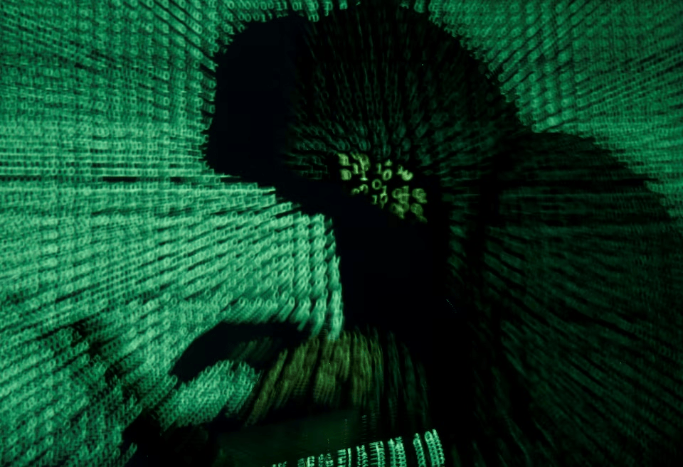 A man holds a laptop computer as cyber code is projected on him in this illustration picture taken on May 13, 2017. REUTERS/Kacper Pempel/Illustration/File Photo A man holds a laptop computer as cyber code is projected on him in this illustration picture taken on May 13, 2017. REUTERS/Kacper Pempel/Illustration/File Photo