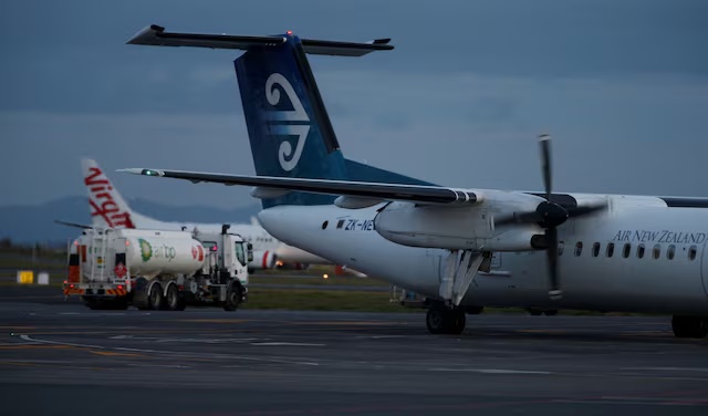 An Air New Zealand aircraft passes a fuel truck on the tarmac of Auckland Airport in New Zealand, September 20, 2017. REUTERS/Nigel Marple/File Photo