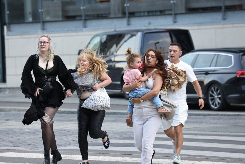 People leave Field's shopping centre, after Danish police said they received reports of shooting, in Copenhagen, Denmark, July 3, 2022. (Ritzau Scanpix/Olafur Steinar Gestsson via REUTERS) People leave Field's shopping centre, after Danish police said they received reports of shooting, in Copenhagen, Denmark, July 3, 2022. (Ritzau Scanpix/Olafur Steinar Gestsson via REUTERS)