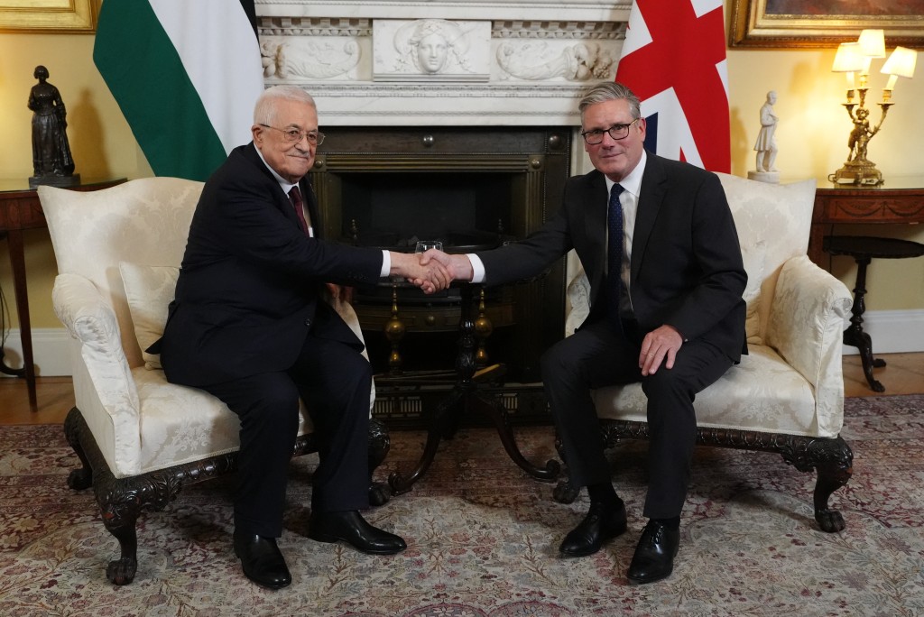 Britain's Prime Minister Keir Starmer (R) shakes hands with Palestinian president Mahmud Abbas (L) at the beginning of their meeting at 10 Downing Street in London on September 8, 2025. (AFP)