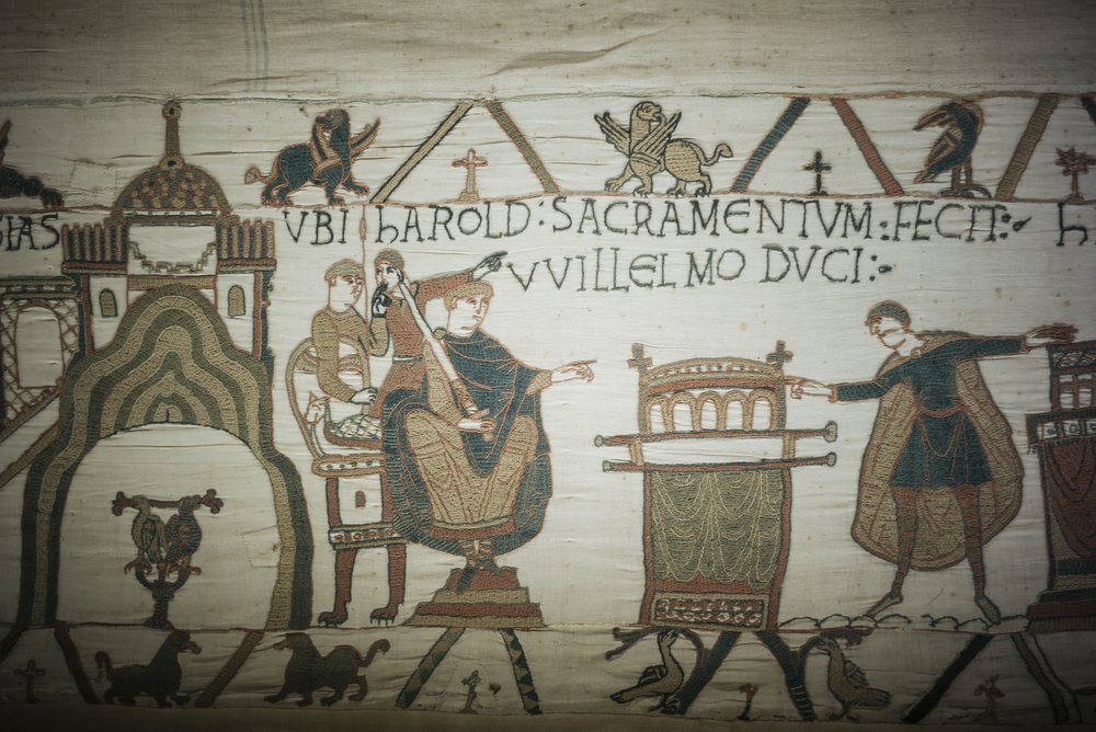 This file photo taken, September 18, 2019 shows a detail of the 11th century Bayeux tapestry chronicling the Norman conquest of England, in Bayeux, Normandy, France. This file photo taken, September 18, 2019 shows a detail of the 11th century Bayeux tapestry chronicling the Norman conquest of England, in Bayeux, Normandy, France.