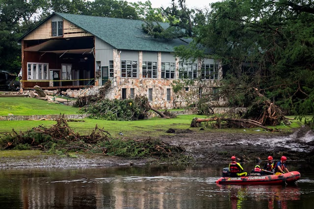 Search teams continue searching for flood victims near Camp Mystic, in the aftermath of deadly flooding in Kerr County, Texas, U.S., July 7, 2025. REUTERS/Sergio Flores/File Photo