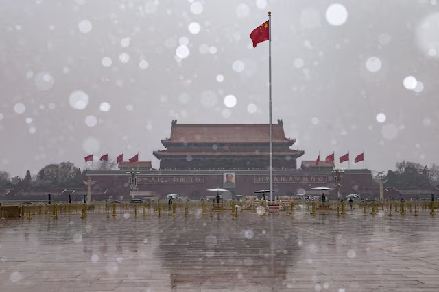 A Chinese national flag flutters near the Tiananmen Gate in Beijing, China March 4, 2026. REUTERS/Tingshu Wang
