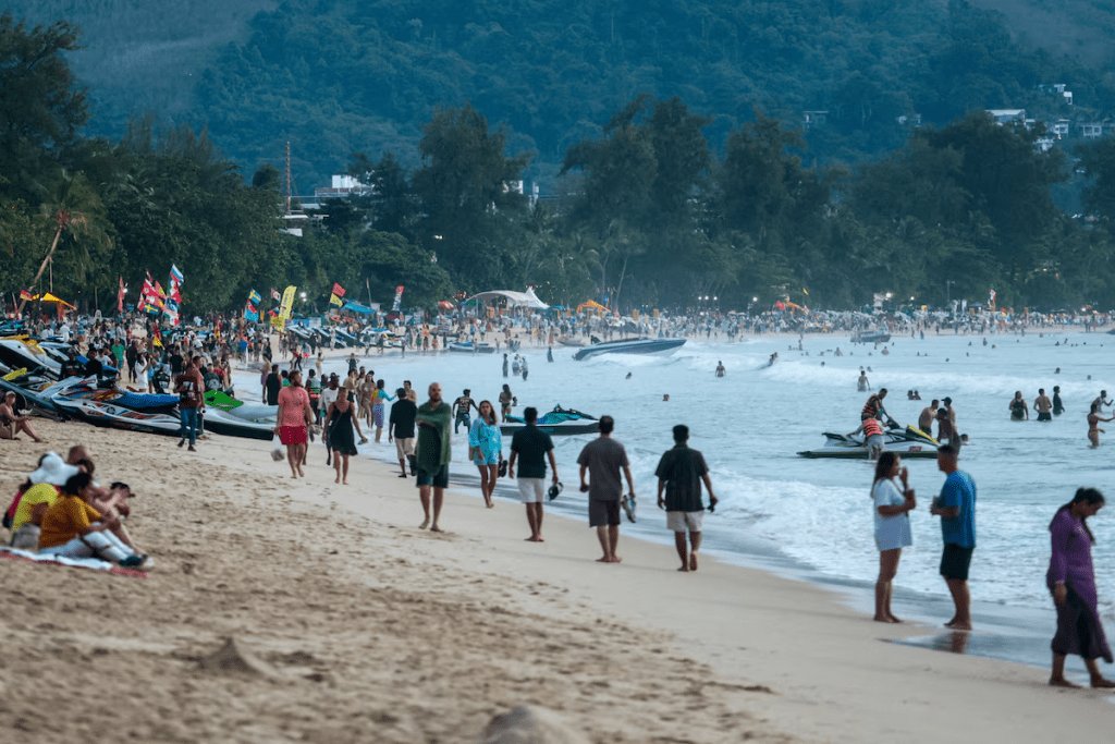 Tourists gather at Patong beach in Phuket, Thailand, November 22, 2024. REUTERS/Napat Wesshasartar/ File Photo