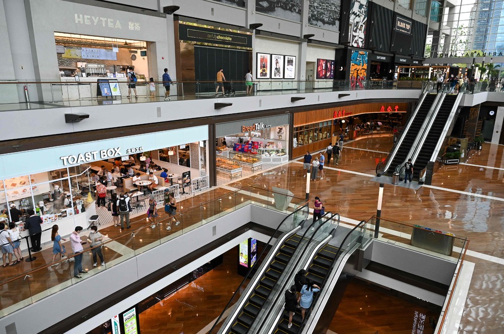 From tomorrow people in Singapore don't need to wear masks in malls – but they have to on public transport and in health-care facilities. AFP From tomorrow people in Singapore don't need to wear masks in malls – but they have to on public transport and in health-care facilities. AFP