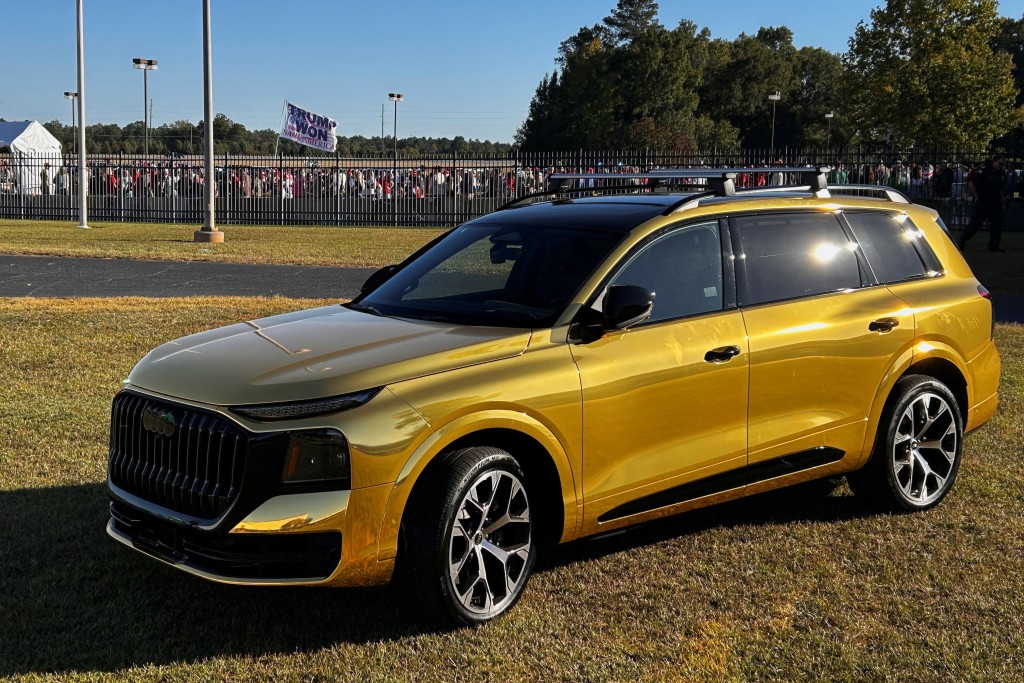 A gold Audi Q9 SUV is displayed outside the venue of US President Donald Trump's political rally before his arrival in Perry, Georgia, US, October 24, 2026. Picture taken with a mobile phone.  REUTERS