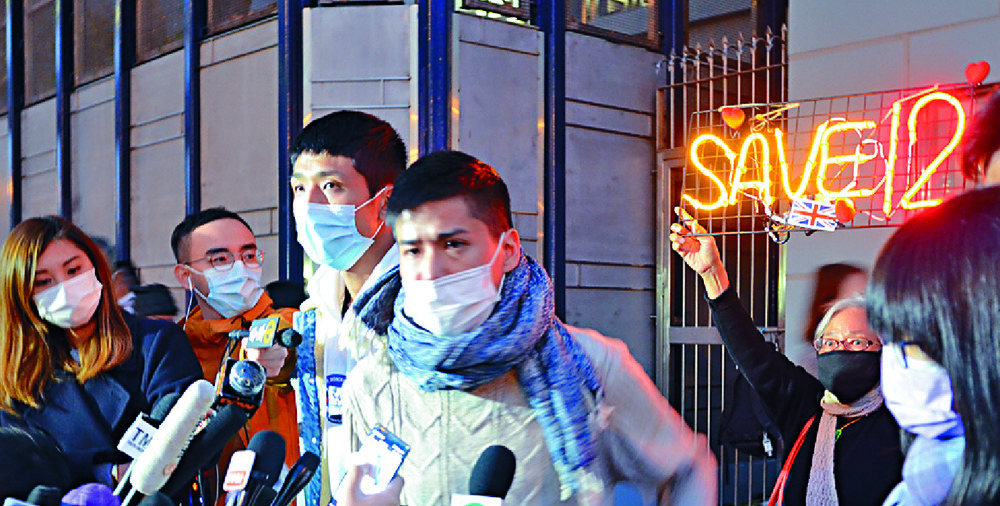 Protesters outside Tin Shui Wai police station last night. Inset, Tang Kai-yin,far left, and Andy Li. Sing Tao Protesters outside Tin Shui Wai police station last night. Inset, Tang Kai-yin,far left, and Andy Li. Sing Tao