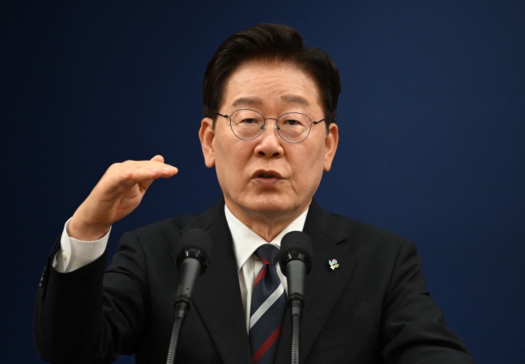 Photo by JUNG YEON-JE / AFP. South Korean President Lee Jae Myung speaks during a press conference on his G7 trip at the presidential Blue House in Seoul on June 19, 2026.