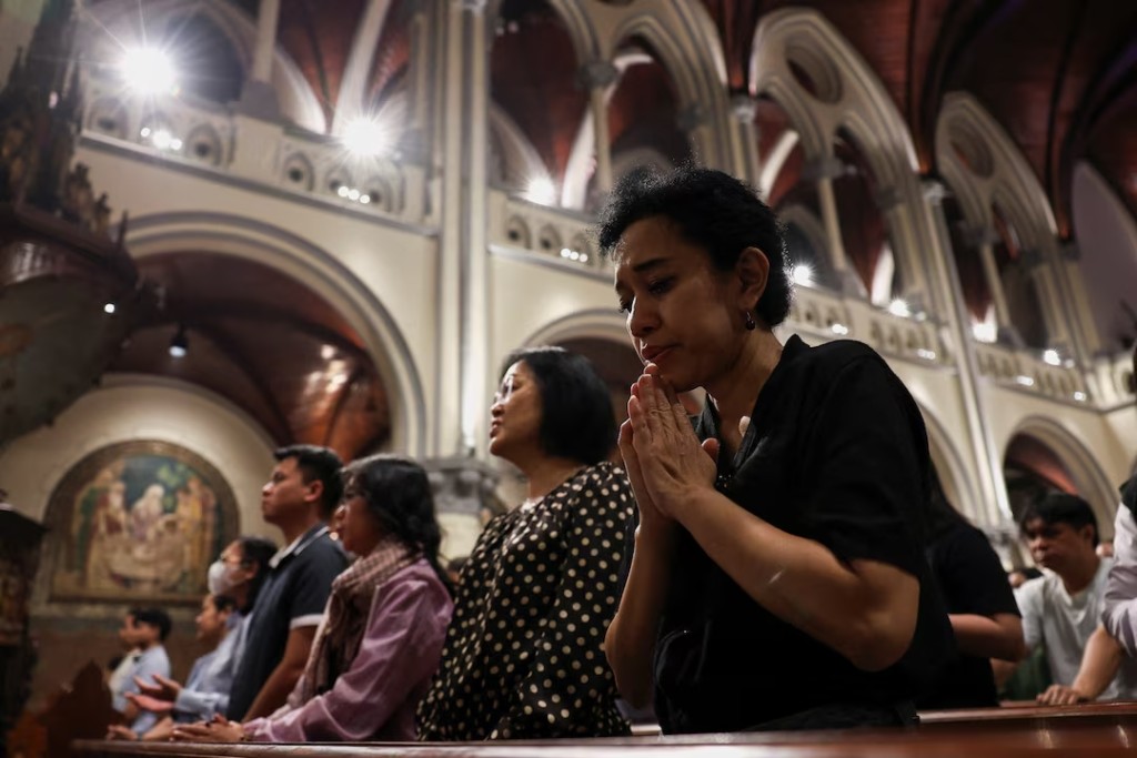 Indonesian Catholics pray for Pope Francis, after his death was announced by the Vatican, during a Mass at the Cathedral of Our Lady of the Assumption in Jakarta, Indonesia, April 21, 2025. (Reuters)