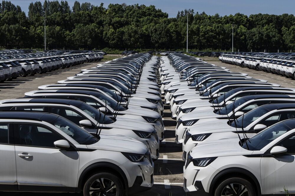 Vehicles manufactured by Dongfeng Peugeot-Citroen Automobile, a joint venture between Dongfeng Motor and PSA Peugeot Citroen, at a lot in Wuhan, China, on Monday, July 22, 2024.  Bloomberg