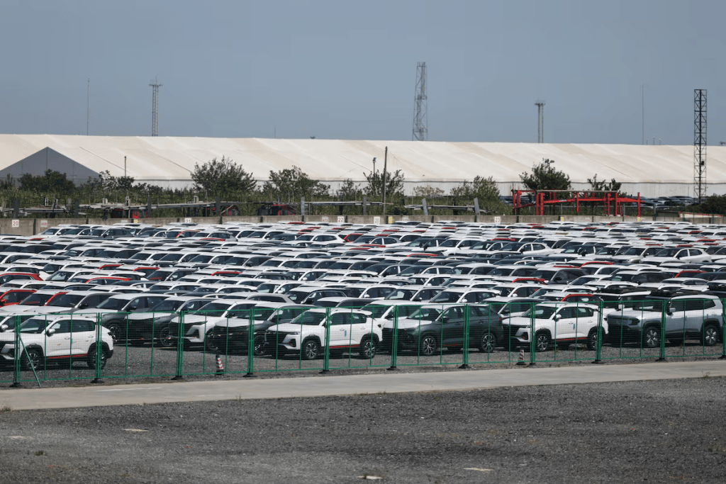 New cars are stored at a parking lot in Shanghai, China, September 8, 2025. REUTERS/Go Nakamura/File Photo 