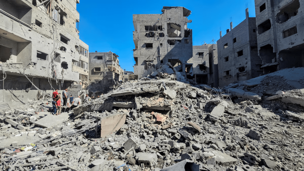 Palestinians gather at the site of Israeli strikes on houses and residential buildings, amid the ongoing Israel-Hamas conflict, in Beit Lahiya, in the northern Gaza Strip October 20, 2024. REUTERS/Abdul Karim Farid/File Photo