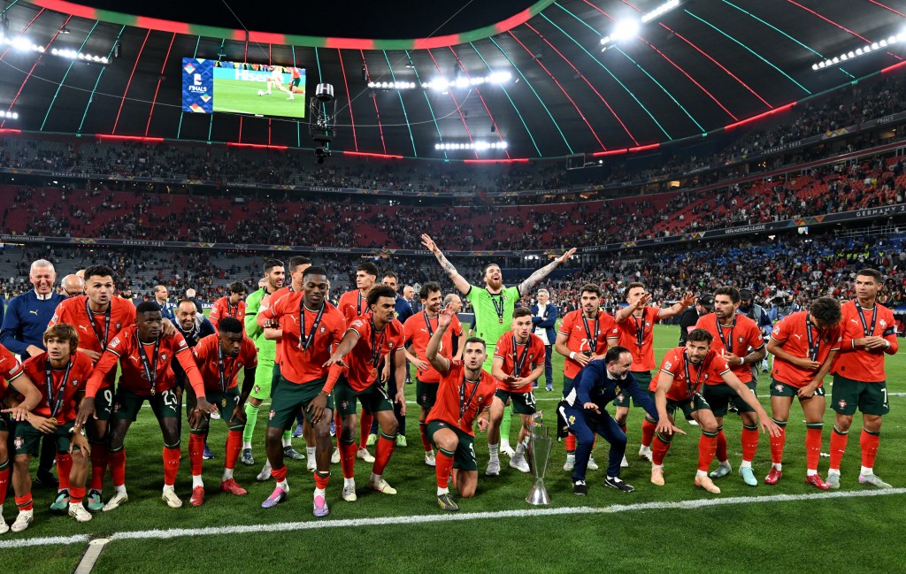 Portugal players celebrate with the trophy in front of their fans after winning the Nations League. (Reuters)