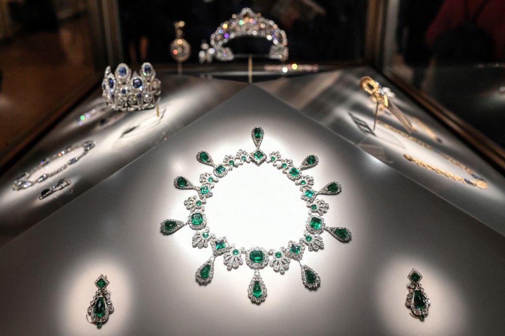 Photo by STEPHANE DE SAKUTIN / AFP  This photograph shows the necklace and earrings of the set of jewelry of Empress of the French, Marie-Louise ("Collier et boucles d'oreilles de la parure d’émeraudes de l'impératrice Marie-Louise") displayed at Apollon's Gallery on January 14, 2020 at the Louvre museum in Paris after the reopening of the Gallery following ten months of renovations.