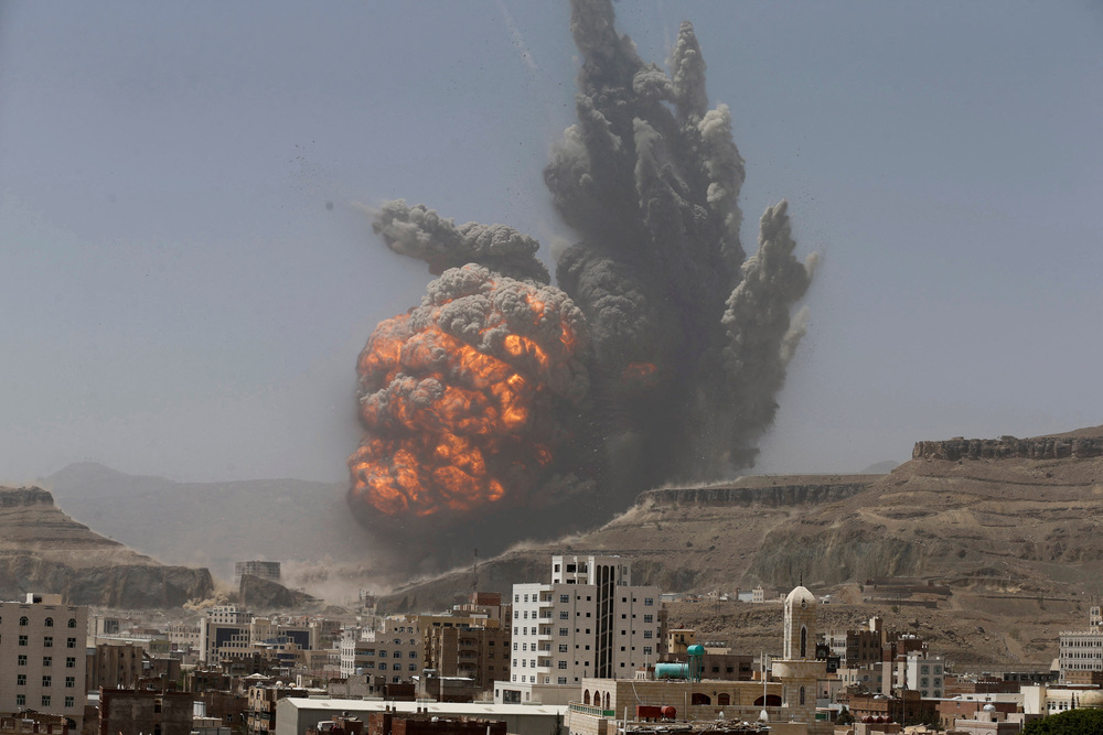 Smoke rises during an air strike on an army weapons depot on a mountain overlooking Yemen's capital Sanaa. (Reuters)