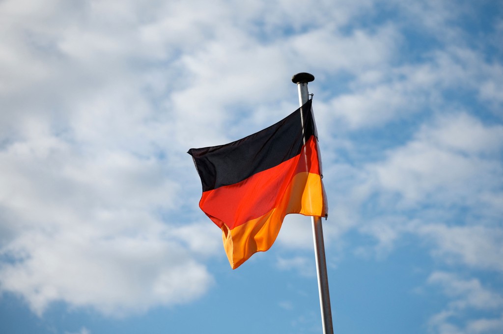 A German flag flutters in the wind near a polling station in Schwerin during regional elections in the northeastern federal state of Mecklenburg-Western Pomerania on September 20, 2026. (Photo by Ronny HARTMANN / AFP)