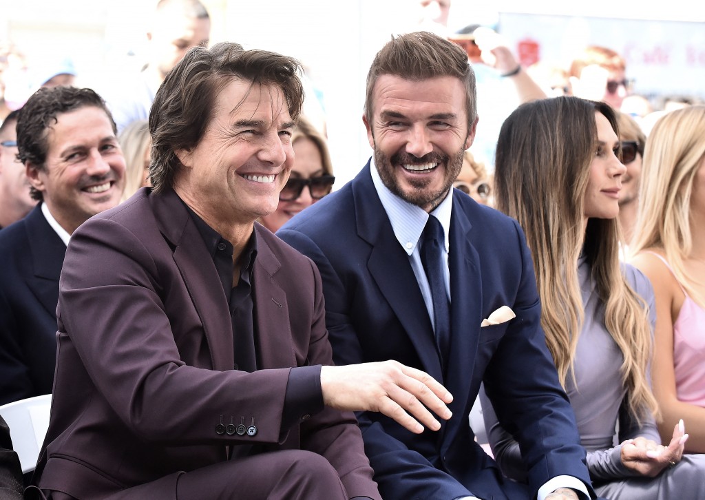 English former footballer David Beckham (C), his wife Victoria Beckham (R) and US actor Tom Cruise attend Beckham's Hollywood Walk of Fame star ceremony in Hollywood, California, on June 12, 2026. (Photo by LISA O'CONNOR / AFP)
