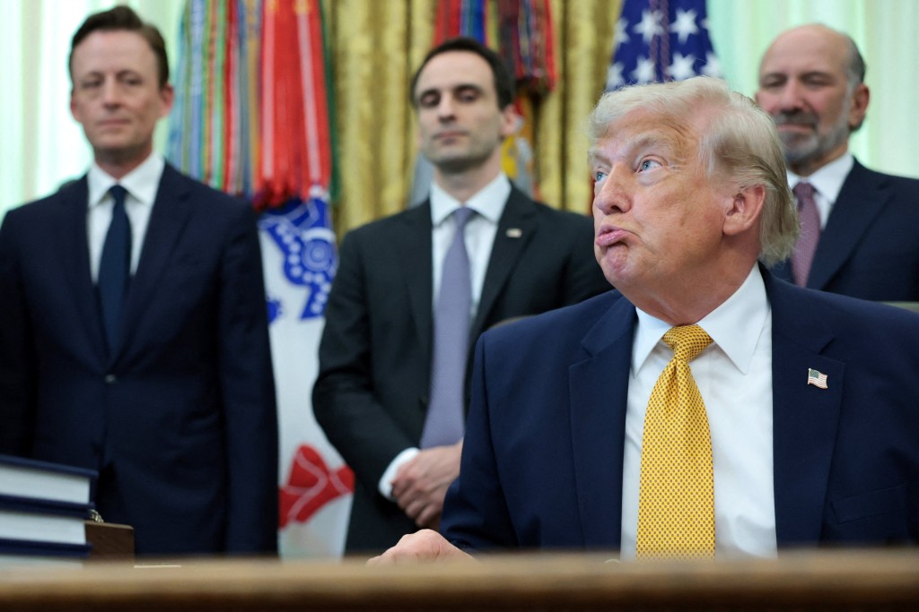 U.S. President Donald Trump looks on as he speaks to reporters before signing two executive orders regarding quantum computing, in the Oval Office at the White House in Washington, D.C., U.S., June 22, 2026. REUTERS/Jonathan Ernst