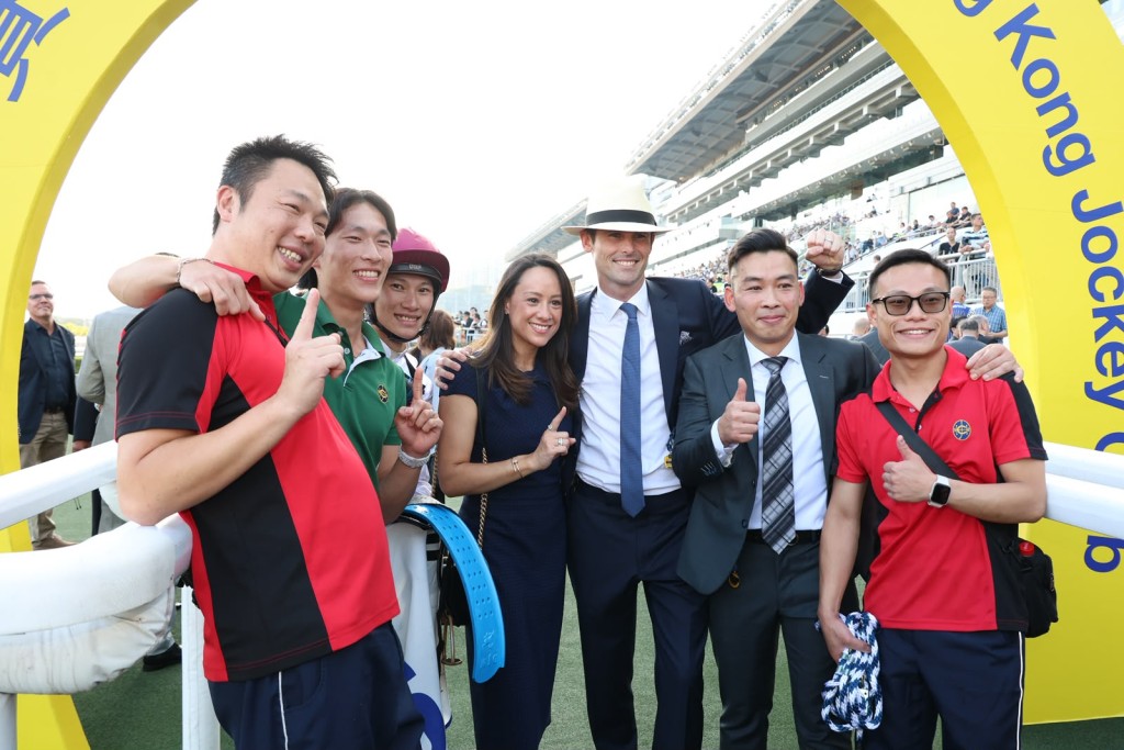 Team Cummings celebrate their first Hong Kong winner after Grand Eagle broke through at Sha Tin. Sing Tao