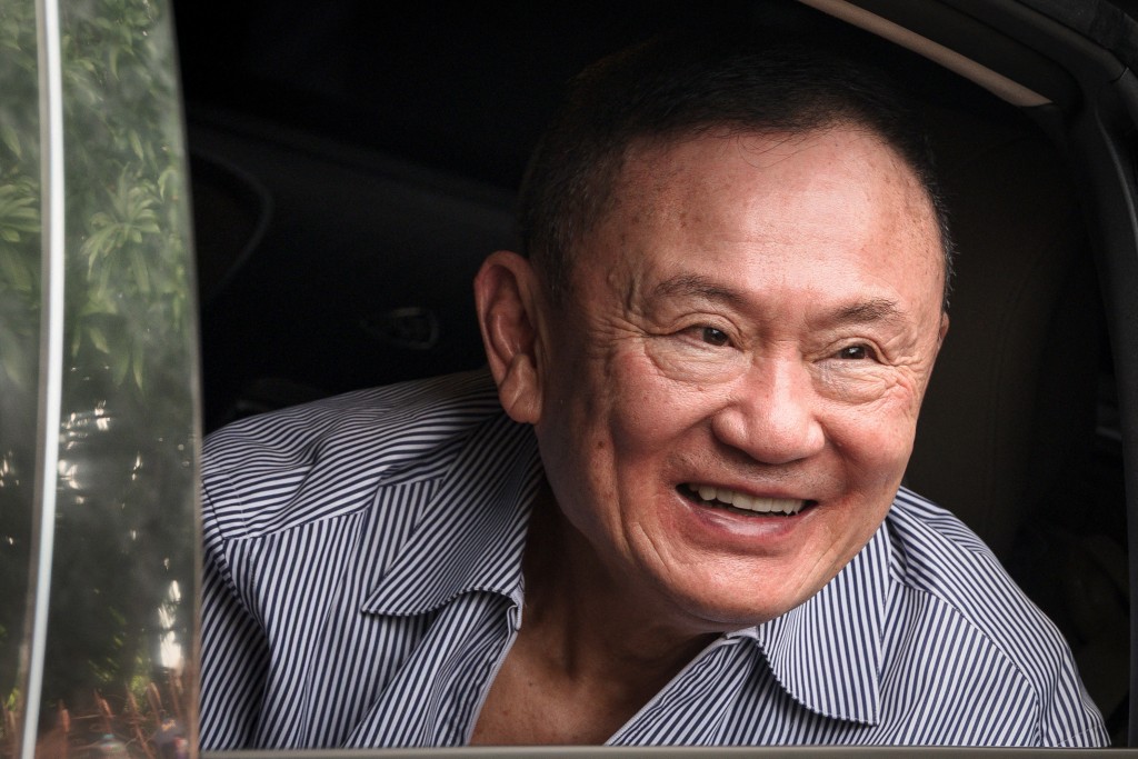 Thailand's former prime minister Thaksin Shinawatra looks on as he arrives at his residency in a car after his release from Klong Prem Central Prison in Bangkok on May 11, 2026. (AFP)