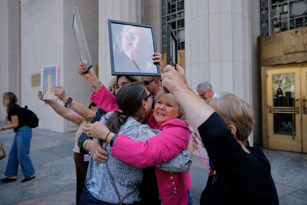 Mothers, lawyers and supporters celebrate outside of the court. Reuters