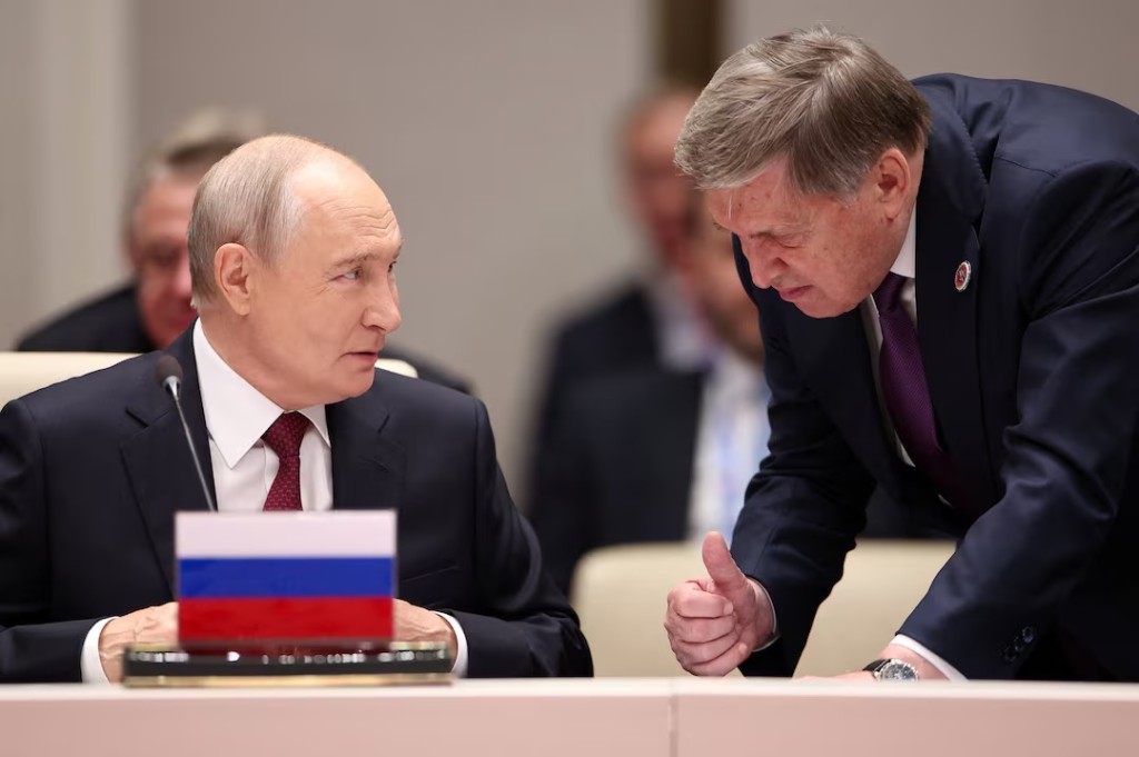 Russian President Vladimir Putin talks to his aide Yury Ushakov before a session of the Shanghai Cooperation Organisation (SCO) summit in Bishkek, Kyrgyzstan September 1, 2026. Sputnik/Petr Kovalev/Pool via REUTERS
