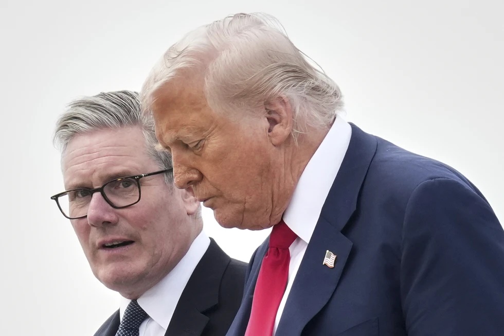 President Donald Trump and Britain’s Prime Minister Keir Starmer exit Air Force One as they arrive at Royal Air Force Lossiemouth en route to Aberdeen, Scotland Monday, July 28, 2025. (AP Photo/Jacquelyn Martin, File)