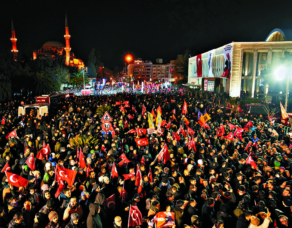 People gather outside city hall to protest the arrest of Ekrem Imamoglu in Istanbul, Turkey. AP People gather outside city hall to protest the arrest of Ekrem Imamoglu in Istanbul, Turkey. AP
