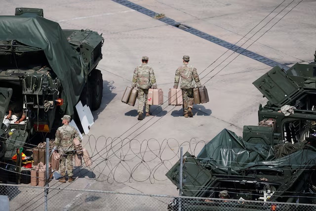 U.S. Army soldiers move jerrycans at a U.S. army base near the demilitarized zone separating two Koreas, in Dongducheon, South Korea, August 18, 2026. REUTERS/Kim Hong-Ji
