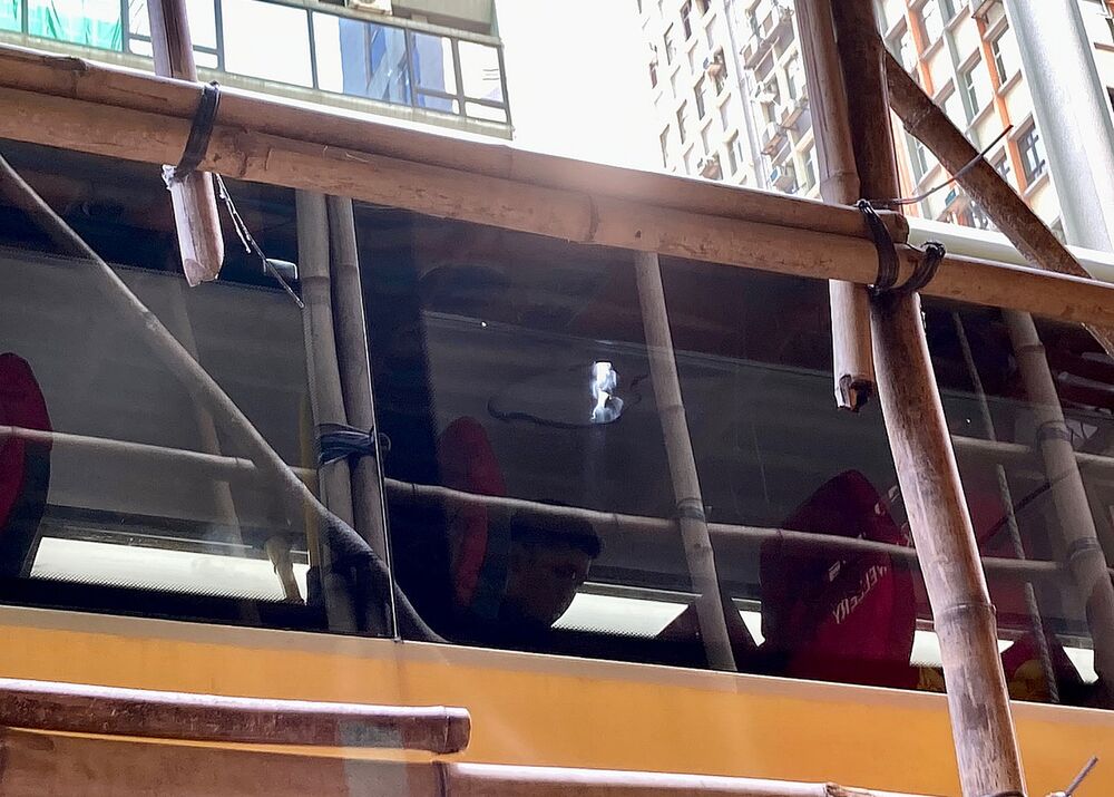 The slab, suspected to have come from a building under renovation, left a 30cm hole in the roof of the bus before breaking into pieces. SING TAO