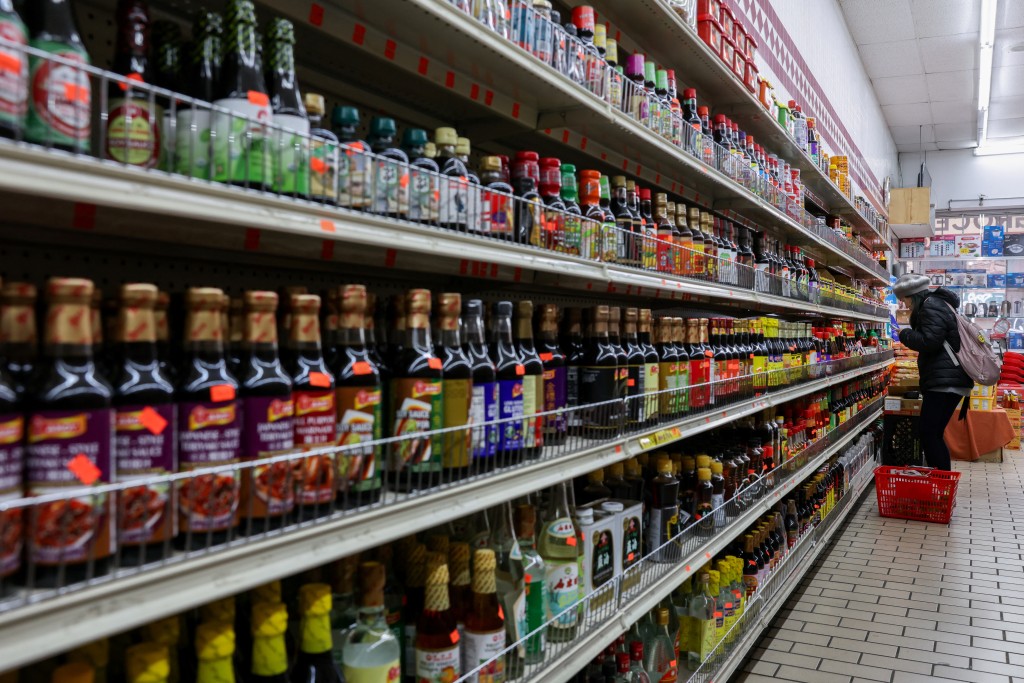 A person shops for sauces at Sun Vin Grocery in Chinatown in New York City, U.S., April 16, 2025. REUTERS