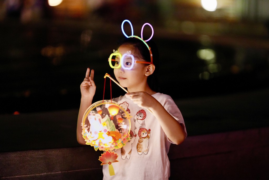 Children celebrate the eve of Mid-Autumn Festival at Victoria Park.