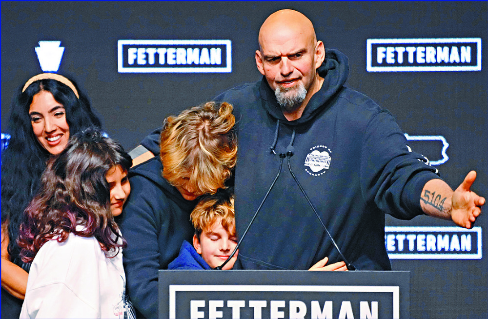 Ron DeSantis celebrates with confetti, John Fetterman embraces his family, Maxwell Frost is cheered by fellow Gen Z members and Raphael Warnock, far left, and Herschel Walker remain neck-and-neck in a race that may well determine the direction of the