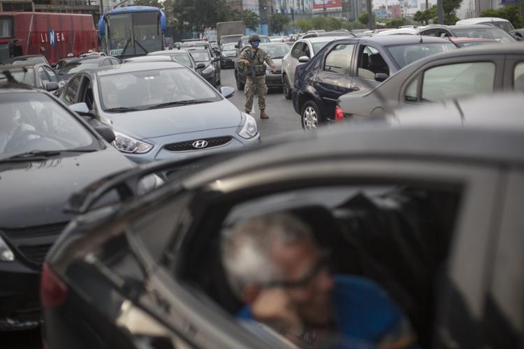 A soldier directs traffic in Lima, Peru, Monday, March 16. Peruvian President Martin Vizcarra declared a state of emergency, ordering citizens to stay in their homes and suspended certain constitutional rights to contain the spread of coronavirus. A soldier directs traffic in Lima, Peru, Monday, March 16. Peruvian President Martin Vizcarra declared a state of emergency, ordering citizens to stay in their homes and suspended certain constitutional rights to contain the spread of coronavirus.