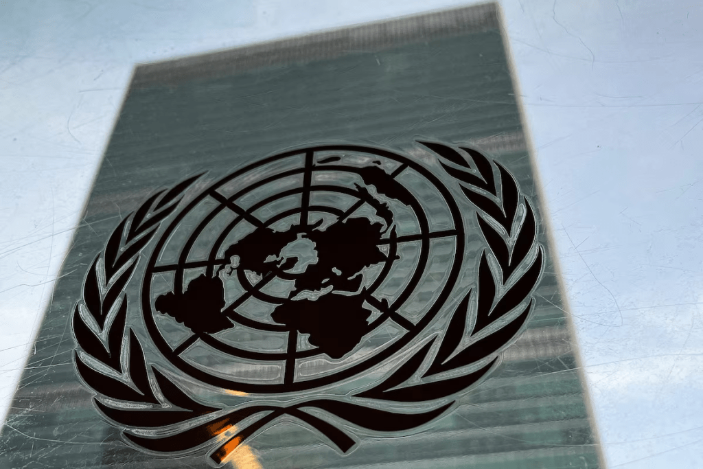 The United Nations headquarters building is pictured with a UN logo in the Manhattan borough of New York City, New York, U.S., March 1, 2022. REUTERS/Carlo Allegri/ File Photo