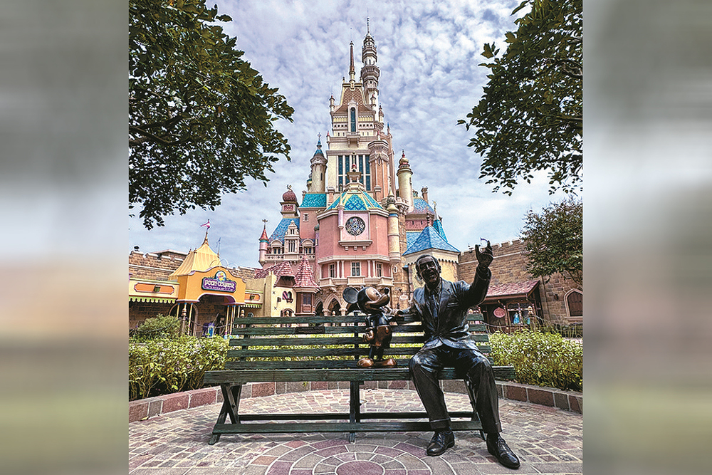 The Dream Makers statue sits in front of the Castle of Magical Dreams.