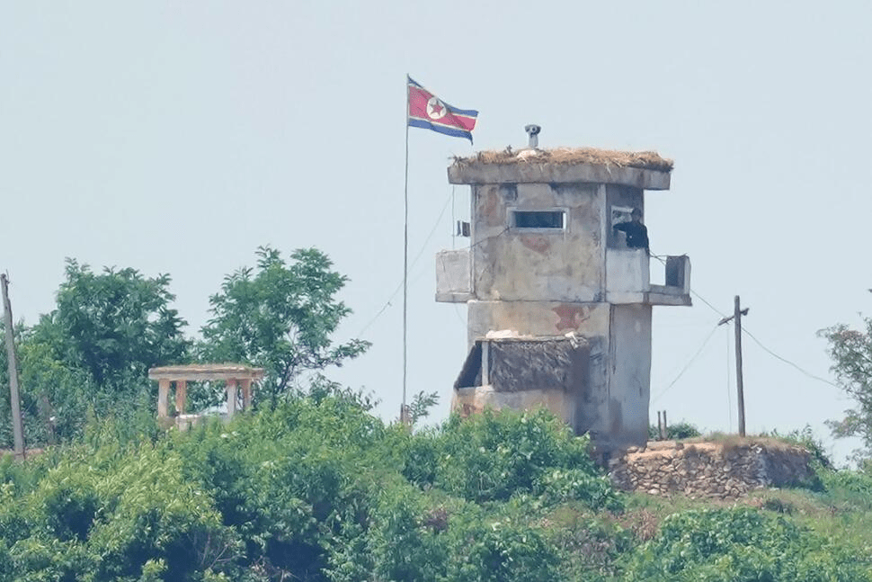 FILE - A soldier stands at a North Korean military guard post flying a national flag, seen from Paju, South Korea, on June 26, 2024. (AP Photo/Lee Jin-man, File) FILE - A soldier stands at a North Korean military guard post flying a national flag, seen from Paju, South Korea, on June 26, 2024. (AP Photo/Lee Jin-man, File)