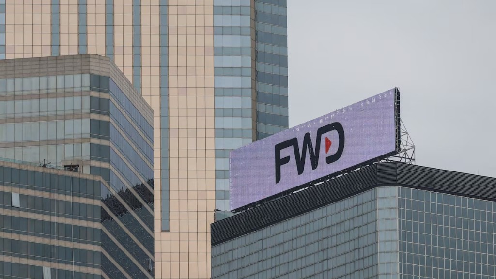 The logo of FWD group is seen on a building in Hong Kong, China March 20, 2023. REUTERS
