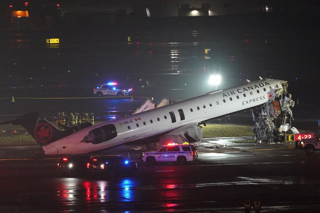 Emergency crews work around an Air Canada Express jet that had collided with a ground vehicle at New York's LaGuardia Airport in Queens, New York, U.S. March 23, 2026. (Reuters)