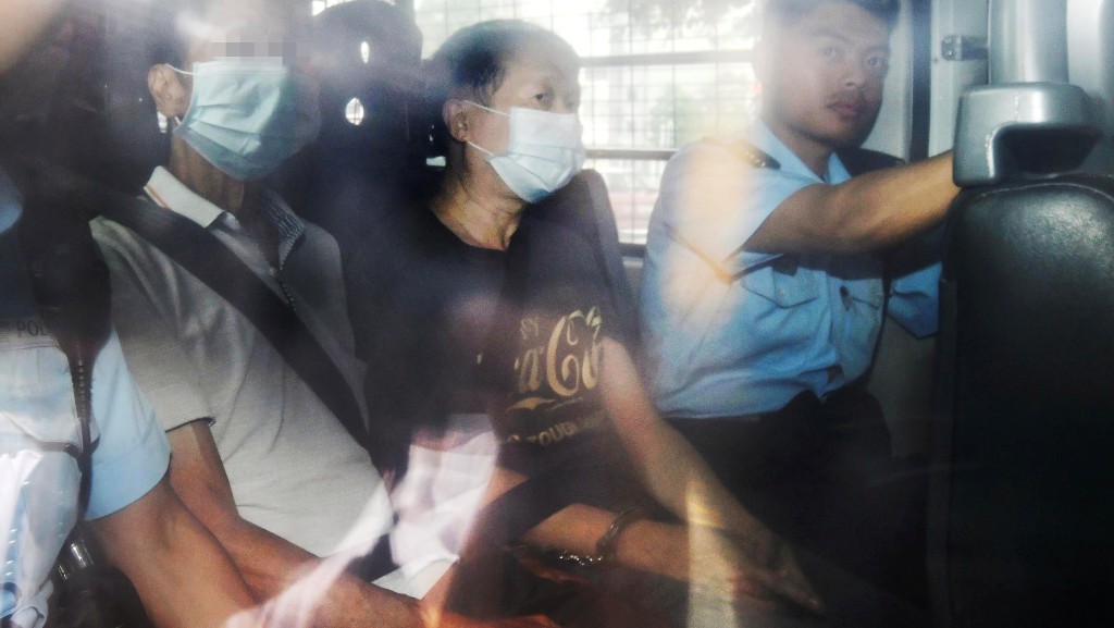 Lo Kim-ngai, 63, previously appeared in Kowloon City Magistrates' Courts wearing a gray T-shirt emblazoned with "Enjoy Coca-Cola.”