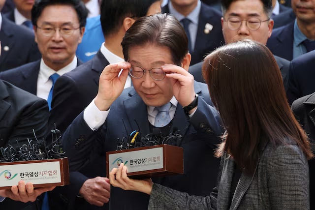 Lee Jae-myung, leader of South Korea's main opposition Democratic Party, arrives at a court in Seoul, South Korea, March 26, 2025. REUTERS/Kim Hong-Ji/Pool/File Photo 