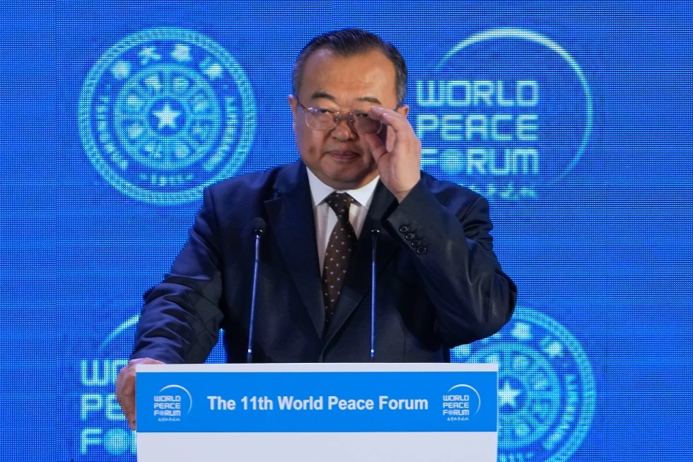 Liu Jianchao, Minister of the International Department of the Chinese Communist Party Central Committee adjusts his glasses during a Q&A session for a lunch meeting of the 11th World Peace Forum at a hotel in Beijing, July 2, 2023. .(AP Photo/Andy Wong, File)