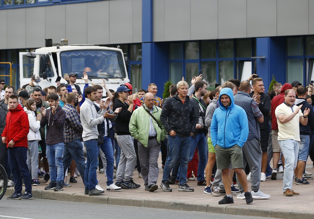 People gather during a rally against the results of the country's presidential election outside the Belarusian Automobile Plant (BelAZ) in Zhodino, about 50 km north-east of Minsk, Belarus.