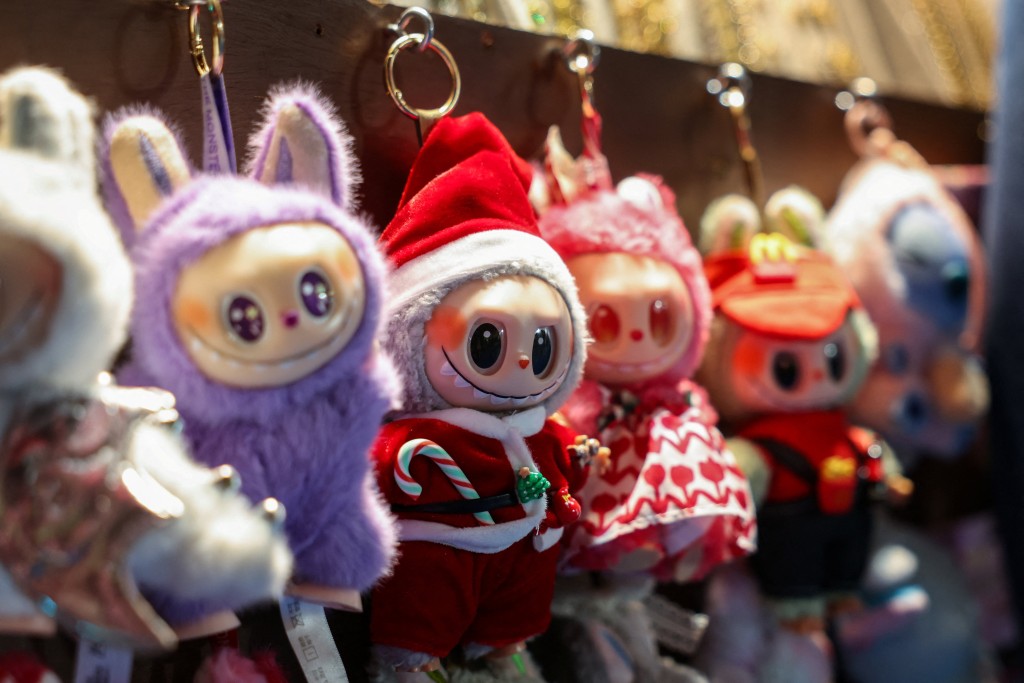 A Labubu in a Santa Claus outfit is displayed for sale at a holiday market in Times Square in Manhattan, New York City, US, November 15, 2025. REUTERS/Kylie Cooper