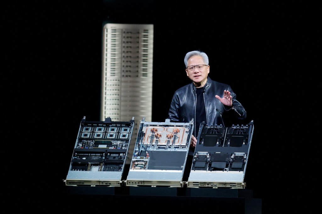 NVIDIA CEO Jensen Huang speaks next to the NVIDIA Vera Rubin system at the NVIDIA GTC global AI conference in San Jose, California, U.S. March 16, 2026.  REUTERS