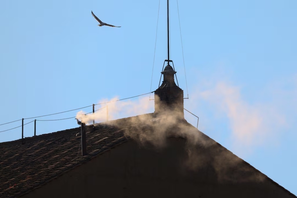 White smoke rises from the chimney on the Sistine Chapel, indicating that a new pope has been elected at the Vatican, May 8, 2025. (Reuters)