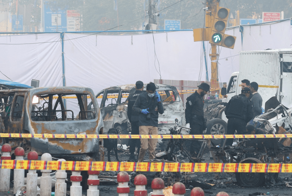 Security personnel work at the site of an explosion near the historic Red Fort in the old quarters of Delhi, India, November 11, 2025. REUTERS/Adnan Abidi