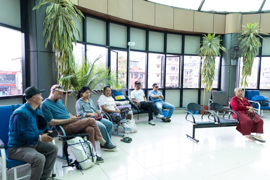 Photo by PRABIN RANABHAT / AFP. Mountaineer Dawa Sherpa's wife Damu Sherpa (C) and daughter Mendo Lhamu Sherpa (3L) along with their relatives wait outside the intensive care unit (ICU) at HAMS Hospital in Kathmandu on June 5, 2026.